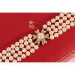 An 18 Carat Gold Four Row Cultured Pearl Choker, the 44:44:44:47 cultured pearls knotted with a