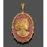 A Rhodonite and Diamond Cameo Pendant, the oval rhodonite plaque with an applied yellow metal