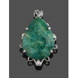 An Emerald Pendant, the pear cut emerald in a white claw setting to a scroll border, measures 7.