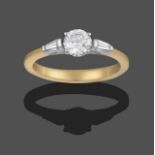 An 18 Carat Gold Diamond Solitaire Ring, the round brilliant cut diamond in a white claw setting, to