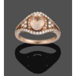 A Morganite and Diamond Ring, the central oval cut morganite flanked by stepped round brilliant