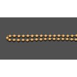 A Bead Necklace, thirty-five spherical yellow metal beads with chain links between, length 44.5cm