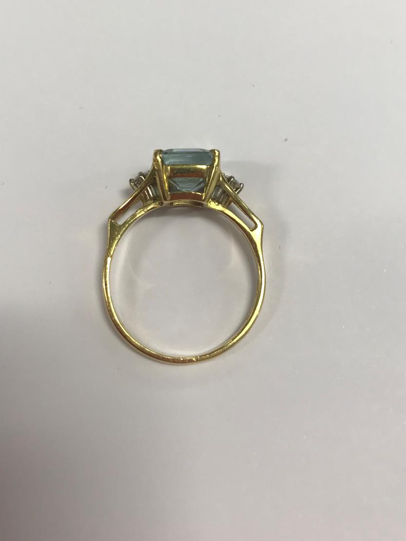 An 18 Carat Gold Aquamarine and Diamond Ring, the emerald-cut aquamarine in a yellow claw setting, - Image 2 of 7