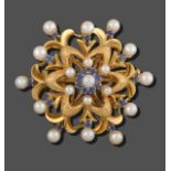 A Cultured Pearl and Synthetic Sapphire Brooch, of domed form, a double yellow textured floral motif