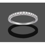 A Diamond Half Hoop Ring, fifteen round brilliant cut diamonds in white claw settings to a plain