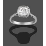 A Diamond Solitaire Ring, the old cut diamond in a white claw and rubbed over setting, to a