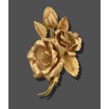 An 18 Carat Gold Floral Brooch, realistically modelled as three rose heads, measures 6.5cm by 3.