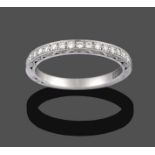 A Diamond Half Hoop Ring, seventeen round brilliant cut diamonds, in white claw settings, to a round