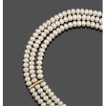 A Triple Row Cultured Pearl Necklace, the 94:99:104 cultured pearls knotted to a yellow textured