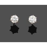 A Pair of 18 Carat White Gold Diamond Solitaire Earrings, the round brilliant cut diamonds in claw