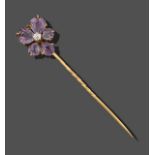 A Flower Head Amethyst and Diamond Stick Pin, the stylised flower head formed of an old cut