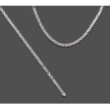 A 9 Carat White Gold Fancy Link Necklace and Bracelet, en suite, rectangular links spaced by