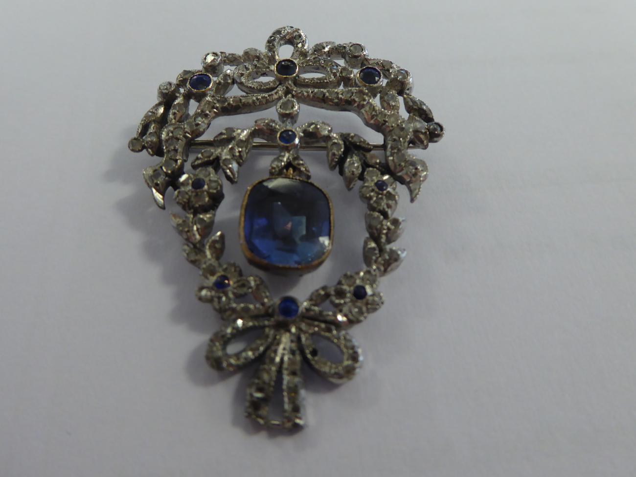 A Synthetic Sapphire and Diamond Garland Brooch, with bow, foliate and swag motifs, measures 3.5cm - Image 5 of 5
