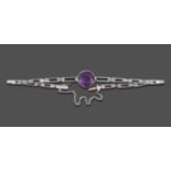 An Amethyst and Diamond Bracelet, a round cut amethyst in a white claw setting, to tapering gate