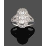 An Art Deco Style Diamond Ring, a trio of round brilliant cut diamonds within a border of smaller