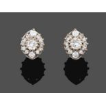 A Pair of 18 Carat White Gold Diamond Cluster Earrings, a round brilliant cut diamond within a