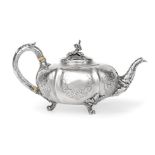 A Victorian Silver Teapot, by John Samuel Hunt, London, 1849, melon-fluted and on three cast