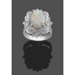 An Opal and Diamond Cluster Ring, the oval cabochon opal in a white four claw setting, within a