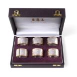 A Set of Six Elizabeth II Parcel-Gilt Silver Napkin-Rings, by Asprey, London, 2002, Britannia