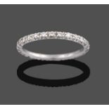 A Diamond Eternity Ring, the old cut diamonds in white claw settings, total estimated diamond weight