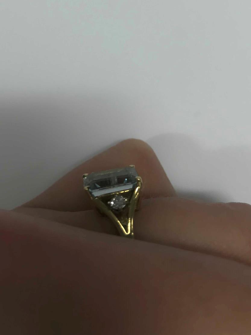 An 18 Carat Gold Aquamarine and Diamond Ring, the emerald-cut aquamarine in a yellow claw setting, - Image 5 of 7