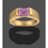 An 18 Carat Gold Pink Sapphire Ring, the emerald-cut pink sapphire in a yellow rubbed over setting