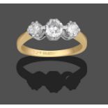 A Diamond Three Stone Ring, the graduated round brilliant cut diamonds in white double claw
