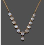 A Moonstone Necklace, the graduated cabochon moonstones with a central pendant drop in yellow collet