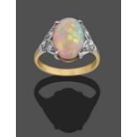 An Opal and Diamond Ring, the oval cabochon opal in a white four claw setting, to trios of old cut