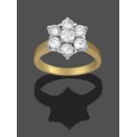 An 18 Carat Gold Diamond Cluster Ring, seven round brilliant cut diamonds in white claw settings, to