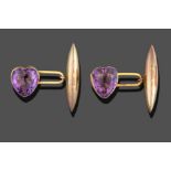 A Pair of 9 Carat Gold Amethyst Cufflinks, the heart shaped amethyst in a yellow rubbed over setting