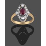 An Art Deco Style Ruby and Diamond Cluster Ring, the oval cut ruby spaced to a border of round