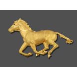 A Galloping Horse Brooch, the textured yellow horse realistically modelled in a galloping pose, with