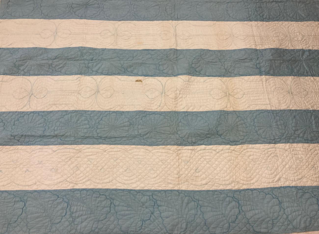 Late 19th Century Blue and White Strippy Quilt, decoratively quilted overall with palm leaves and