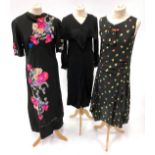Circa 1920/30s Evening Dresses, comprising a black silk sleeveless dress with drop waist, printed