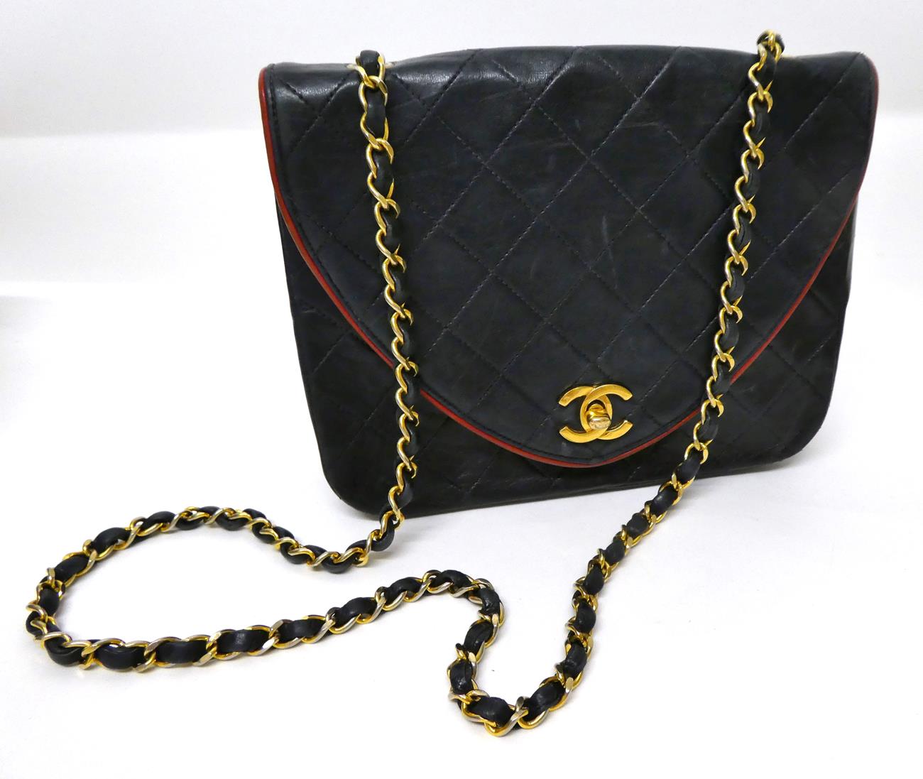 A Circa 1994-1996 Chanel Dark Blue Leather Quilted Shoulder Bag, the D-shaped flap secured by gilt