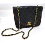A Circa 1994-1996 Chanel Dark Blue Leather Quilted Shoulder Bag, the D-shaped flap secured by gilt
