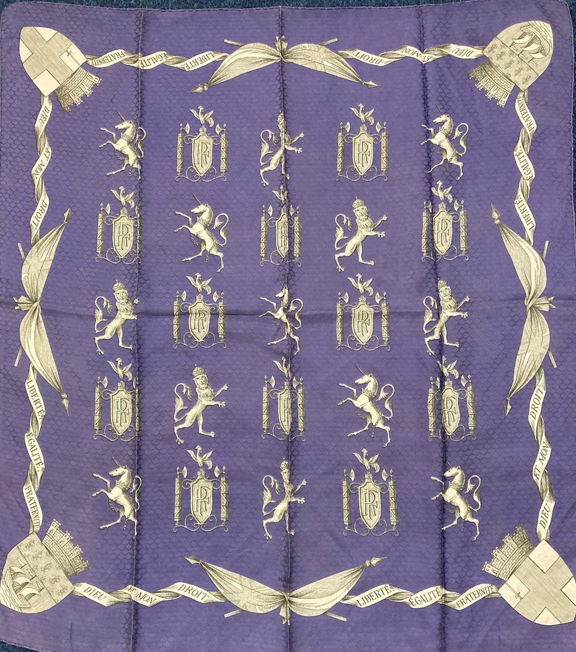 A Hermes Silk Scarf 'Liberté, Ègalité and Fraternite', on a lavender ground woven with a scalloped