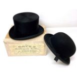 Bates Hatters, London Black Silk Top Hat (in a later box) and a Lock & Co Black Bowler Hat (2) . Top