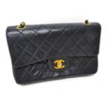 A Circa 1989-1991 Chanel Midnight Blue Quilted Lambskin Leather Handbag, the classic flap bag with