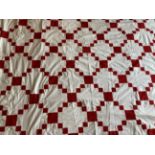 Late 19th Century Irish Chain Pattern Patchwork Bed Cover, in turkey red and white, within a red