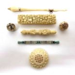 19th Century Ivory Sewing Accessories, including a Dieppe ivory needle case carved with fruit, pears