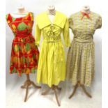 Assorted Circa 1950s Ladies' Printed Cotton Day Dresses, comprising a pink and floral striped dress,