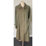 A Burberrys Ladies' Olive Green Fly-Front Coat, Mid 1990s, with check lining and slit pockets (no