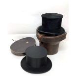 Black Silk Top Hat, labelled A Barritt & Co Middlesbrough, in a brown leather hat box with red