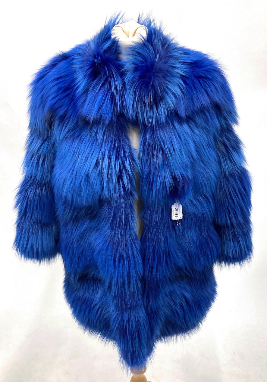 An Italian Dyed Blue Fox Fur Coat, with 3/4 length sleeves and slit pockets, lined in floral silk.