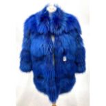 An Italian Dyed Blue Fox Fur Coat, with 3/4 length sleeves and slit pockets, lined in floral silk.