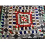 Late 19th Century Wool Country Quilt, worked in frames of striking colours with a central square