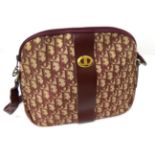 A Christian Dior Oblique Pattern Burgundy and Cream Shoulder Bag, with leather long adjustable