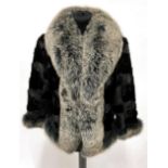 A Black Mink and Silver Fox Fur Jacket, with bracelet length sleeves, the mink bodice trimmed with